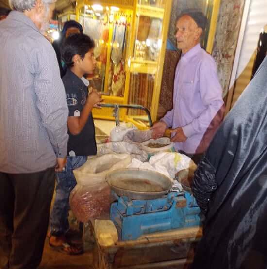 Meeting of a walking merchant in the bazaar at Yazd 