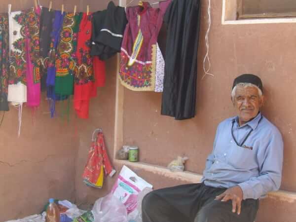 Resident of Abyaneh on the lookout for tourists 